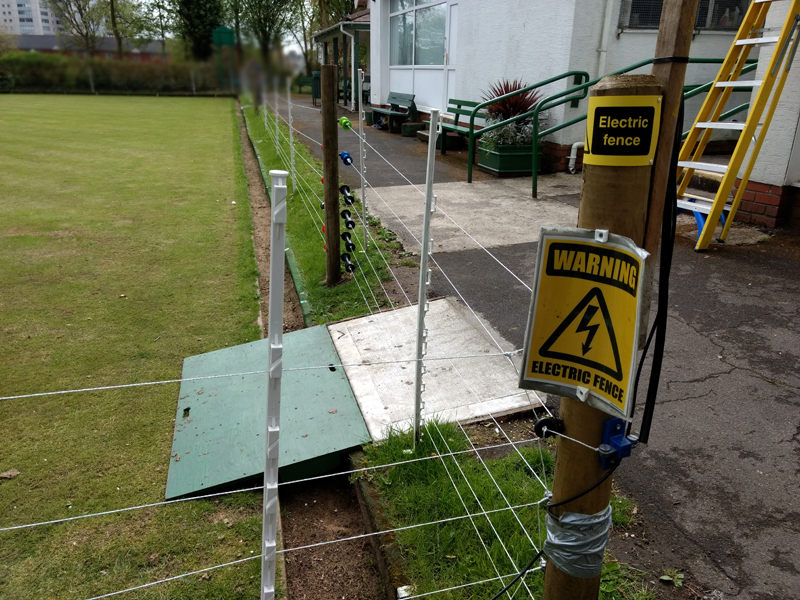 Electric fence around a bowling green Electric fence around a bowling green.